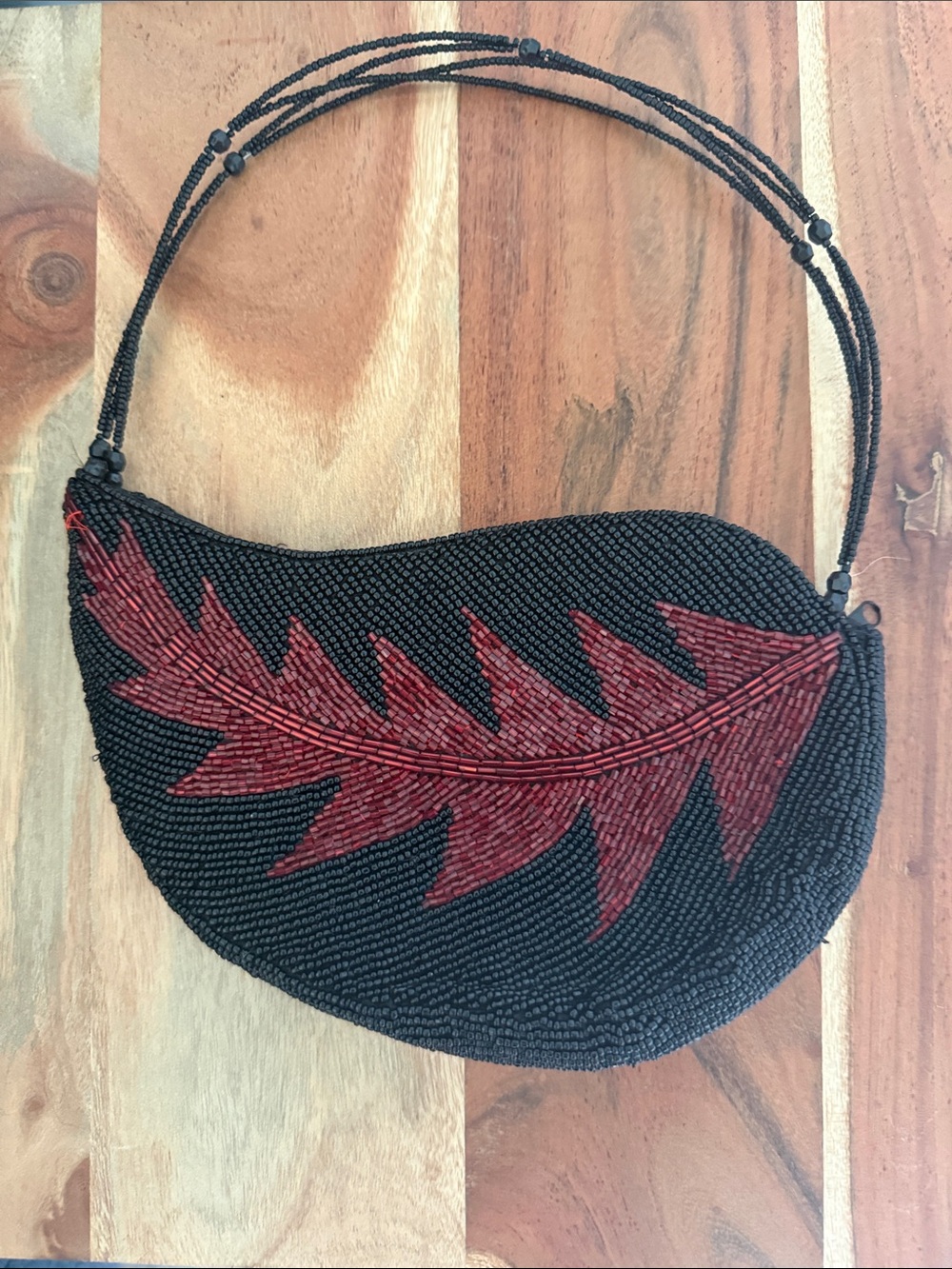 Hand-Beaded Black Clutch with Red Leaf Accent